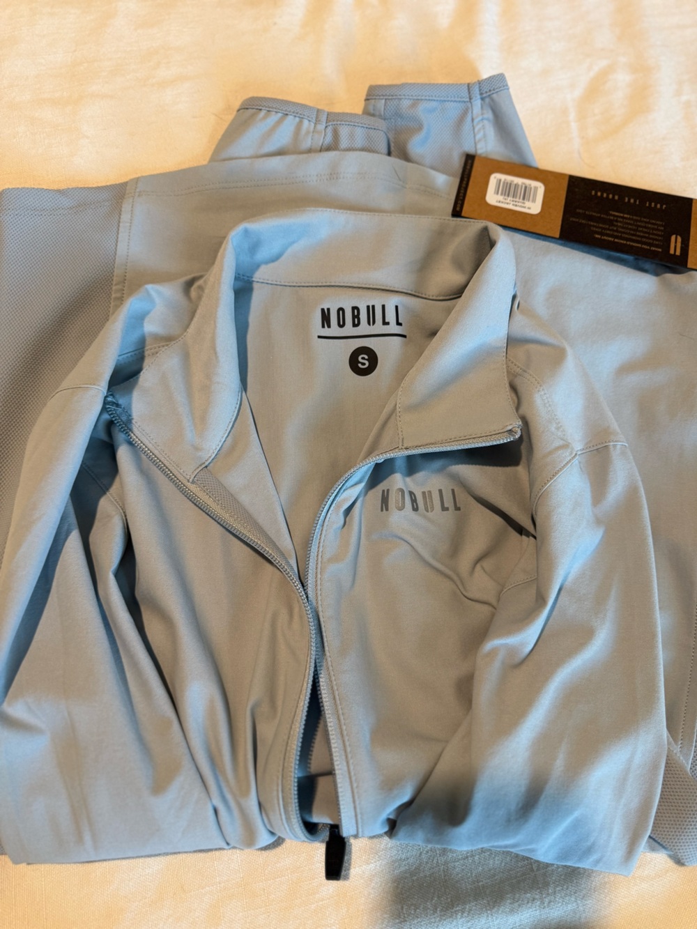 NOBULL Women’s Performance Jacket with Reflective Trim in Quart (silver/gray) - Picture 2 of 5